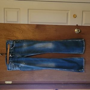 Womans used silver jeans